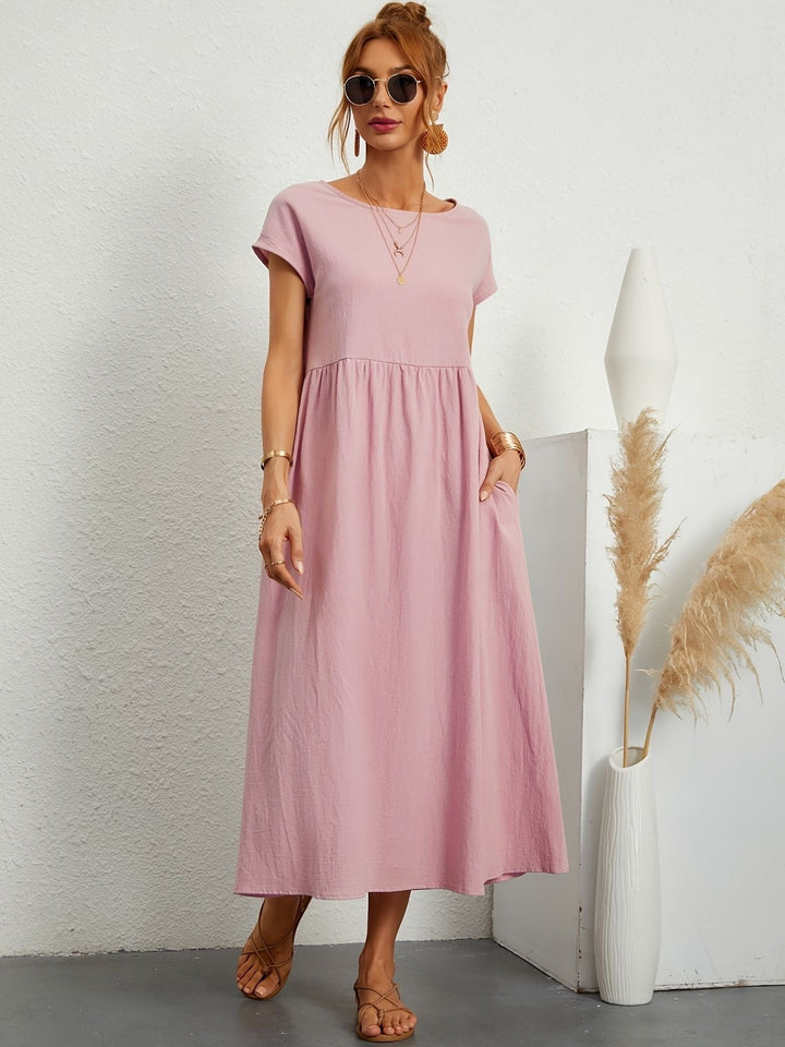 Women's loose fit short sleeve maxi dress, round neck, pockets. Ideal for comfortable casual summer fashion.