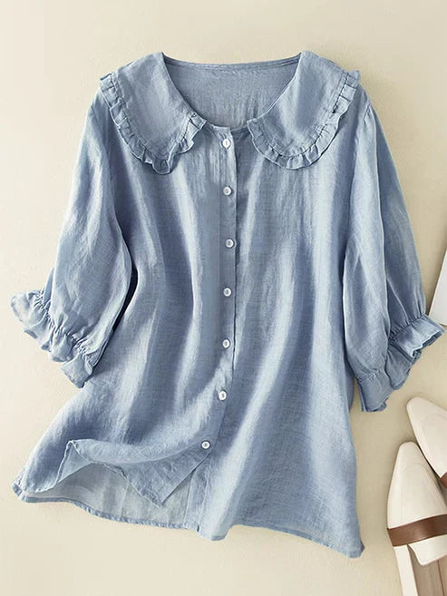 New elegant women's loose fit blouse featuring a chic Peter Pan ruffle neck. Ideal casual top for summer.