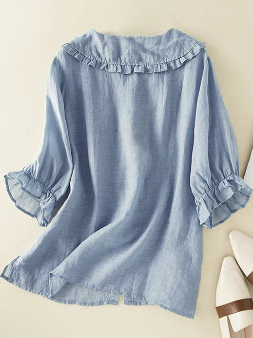 Women's comfortable loose fit button-down shirt with a distinctive Peter Pan ruffle neck for a stylish look.