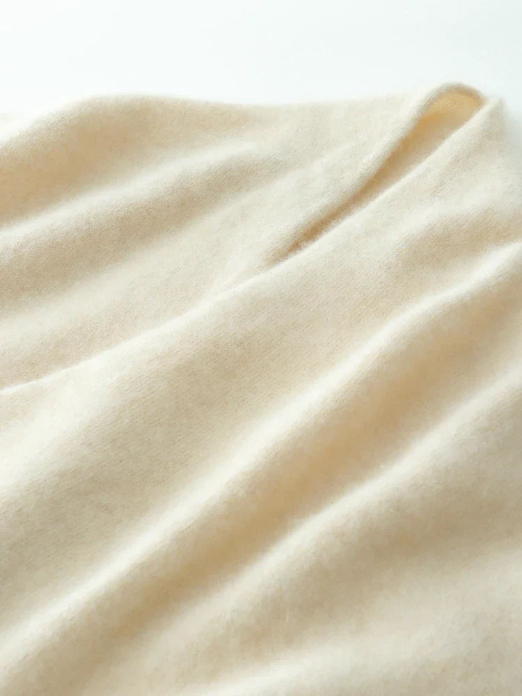 Cozy and elegant women's sweater with a crossover neckline, made from luxurious cashmere knit