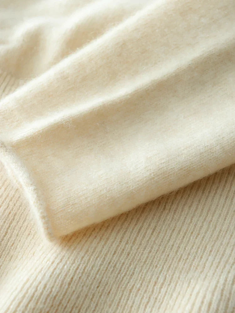 Product flat lay of the Women's Luxe Cashmere Knit Crossover Sweater, showcasing its premium look