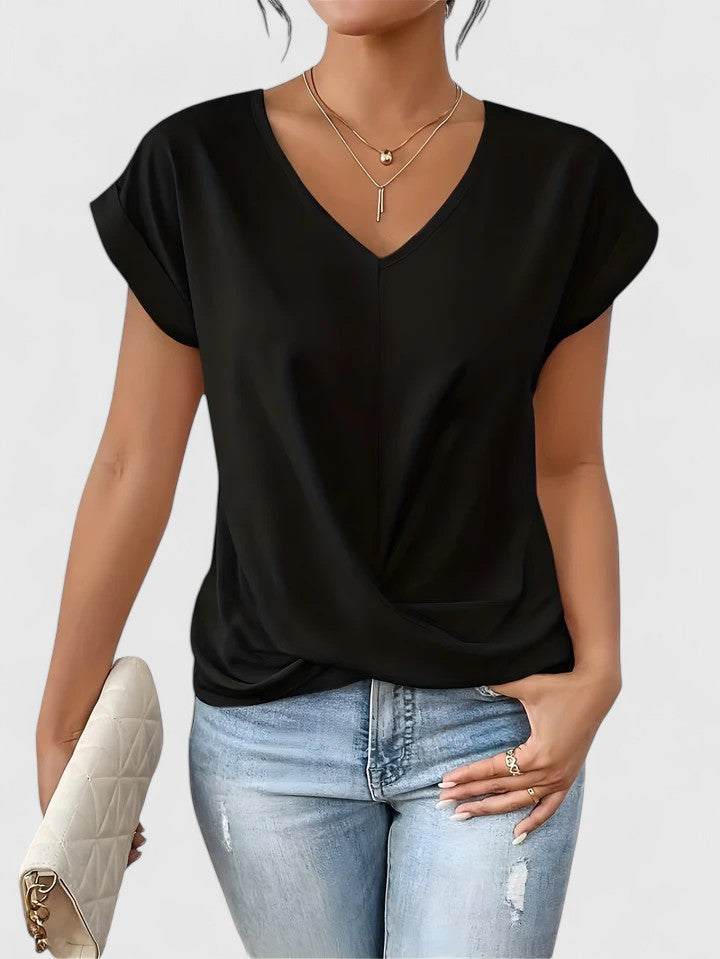 Casual and versatile Mahrianne women's top featuring a flattering V-neck and chic twist front.