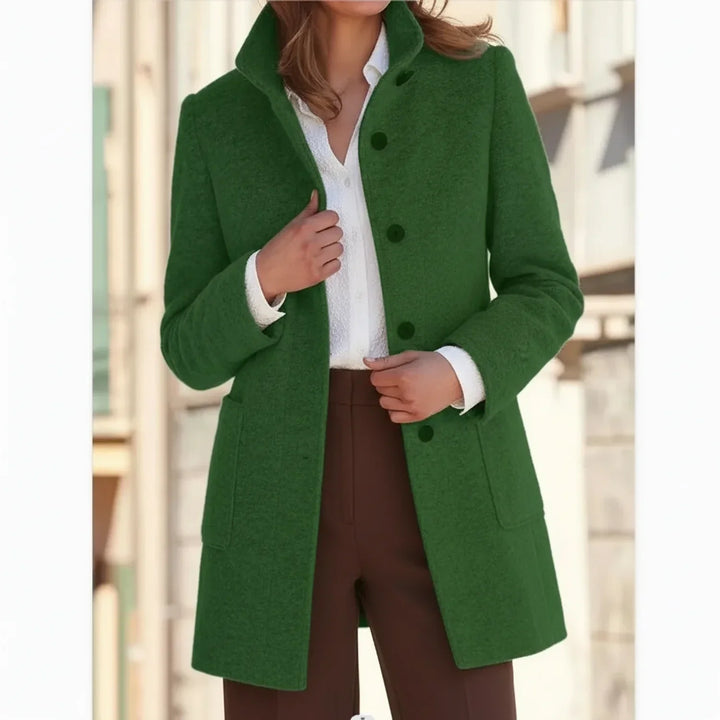 Model wearing a classic women's mid-length fall winter coat. Elegant & warm outerwear for stylish cold-weather looks.