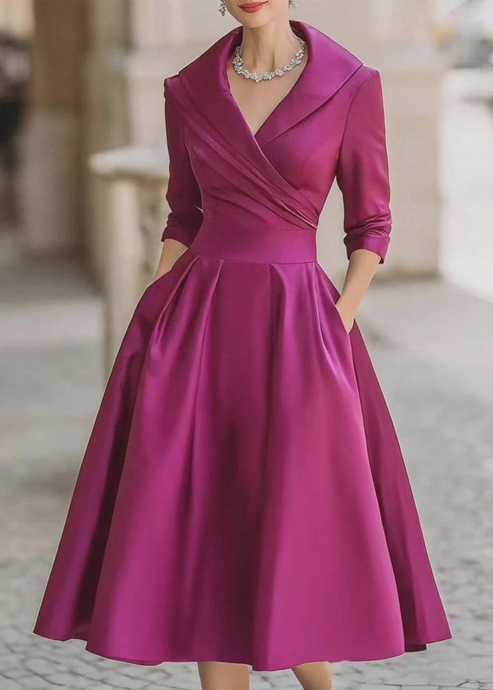Model wearing an elegant women's midi dress with a draped collar, A-line silhouette, and useful pockets.