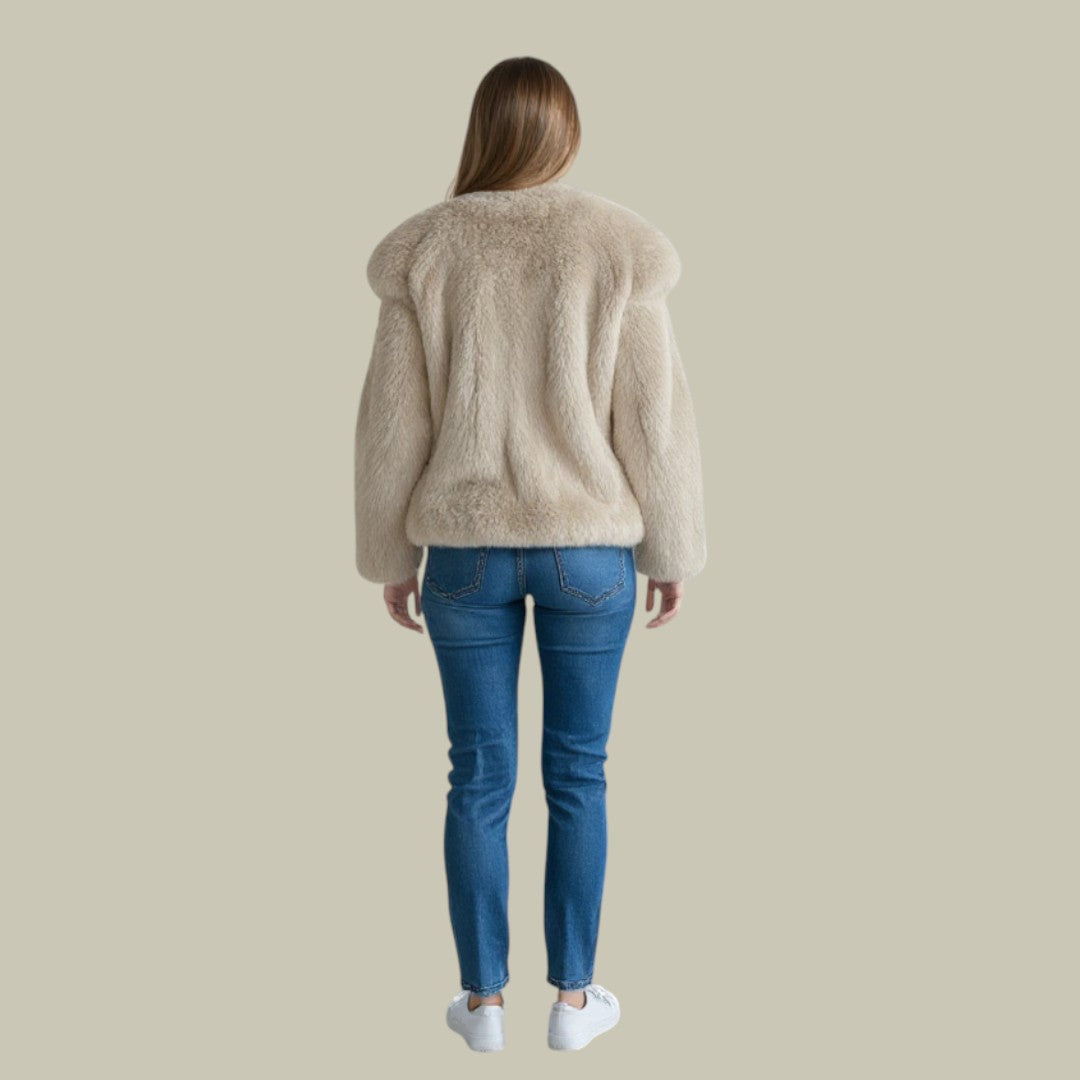 Full view of a woman wearing a modern relaxed fit turtleneck winter sweater
