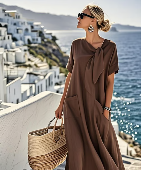 Stylish women's summer maxi dress with a fashionable tie neck, relaxed fit, short sleeves, and functional side pockets.
