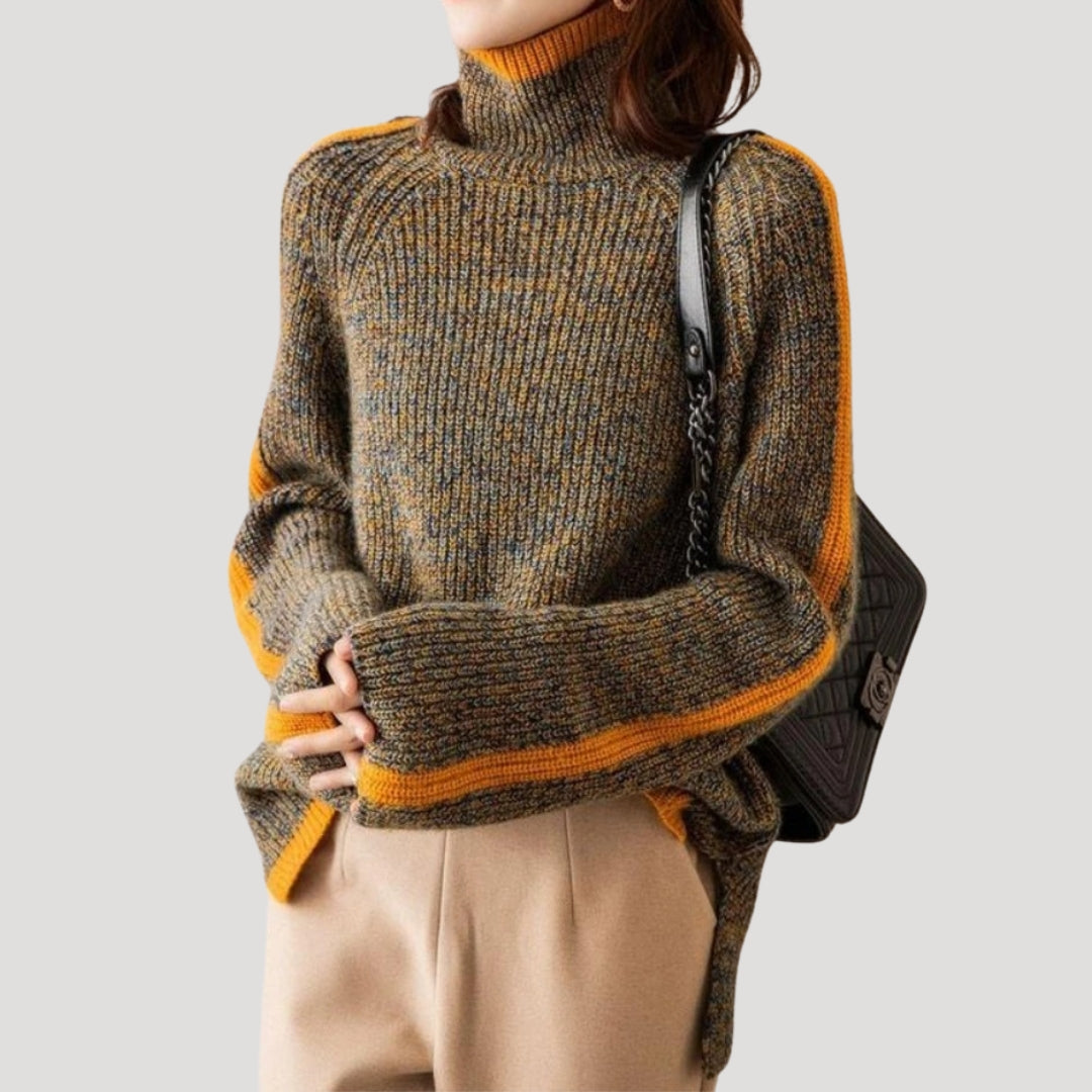 Close-up of women's orange ribbed knit sweater, showcasing turtleneck and knitwear texture