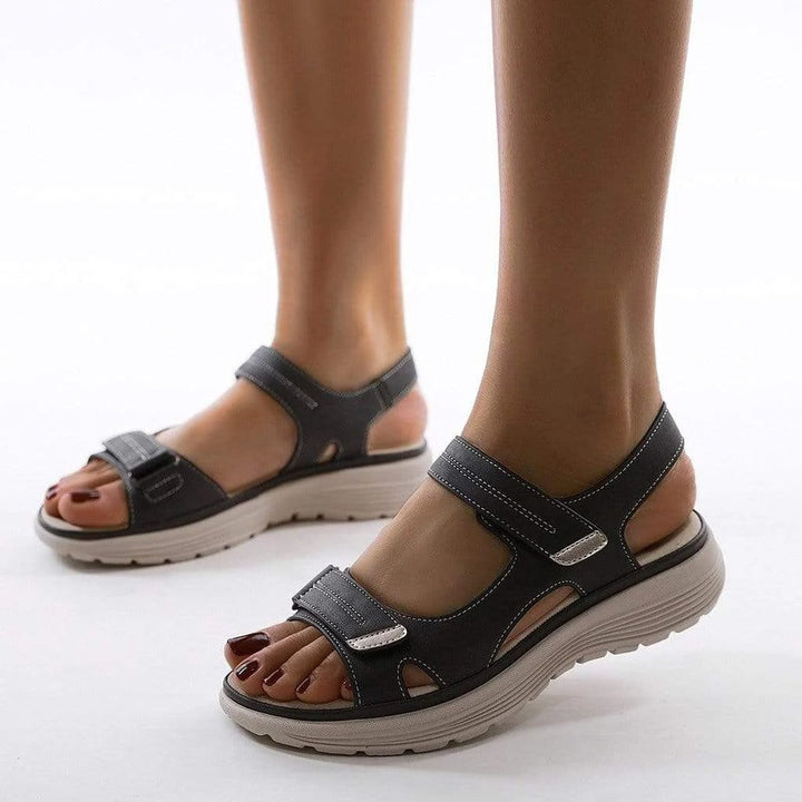 Comfortable women's walking sandals, open-toe design with orthopedic arch support.