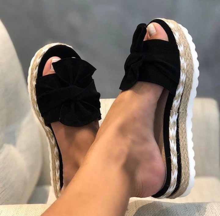Fashionable slip-on women's bow sandals. Orthopedic comfort and support for versatile summer footwear & casual style.