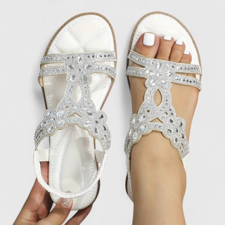 Orthopedic women's sandals in a neutral tone, featuring adjustable straps and arch support for personalized comfort.