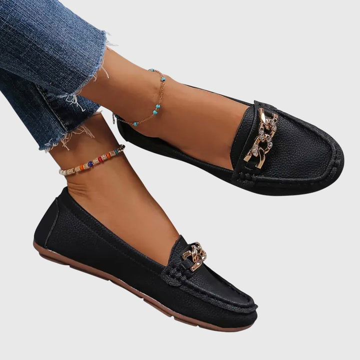 Stylish women's loafers with a gold chain detail. Comfortable orthopedic footwear for fashion & support.