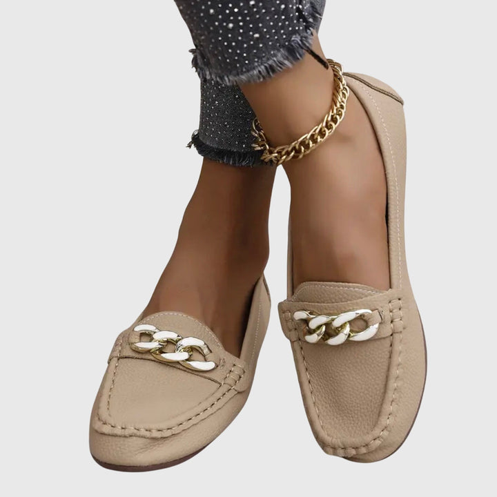 Profile of comfortable women's orthopedic loafers. Chic slip-on shoes with arch support for daily wear.