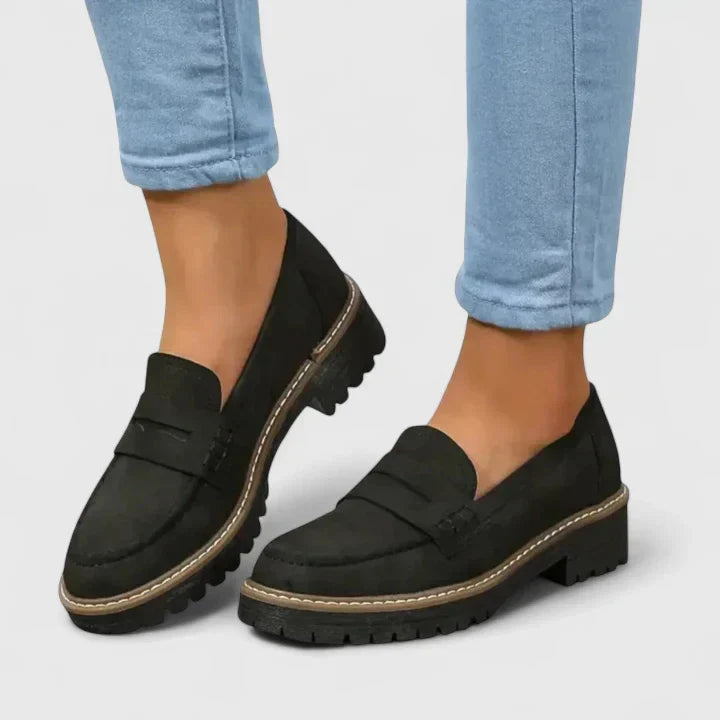 Women's orthopedic loafers in black, designed for all-day comfort with advanced arch support for walking.