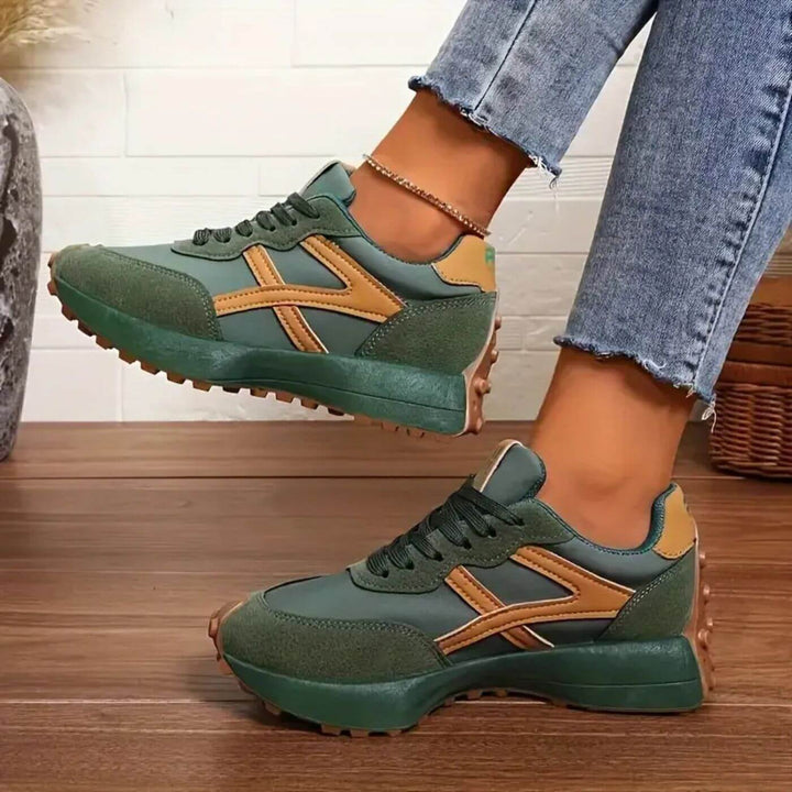 Fashionable women's orthopedic sneakers featuring a unique panel design for all-day comfort and support.