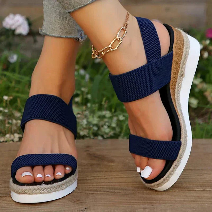 Close-up of orthopedic platform sandal sole, highlighting arch support for women's all-day walking comfort.