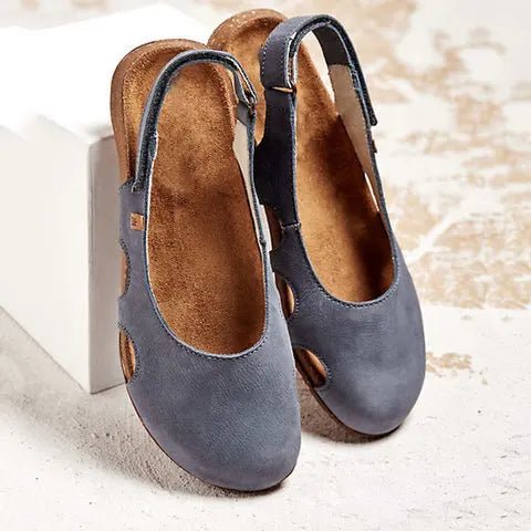 Women's orthopedic sandals with arch support, adjustable straps, & flat sole for all-day comfort & foot health.