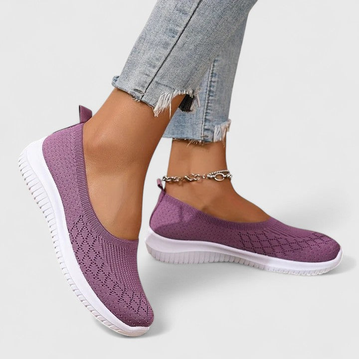Women's orthopedic slip-on shoes with arch support & wide fit for all-day comfort & easy wear.