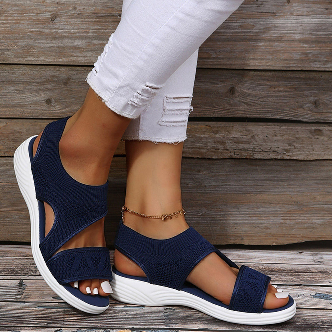 Stylish black orthopedic wedge sandals for women, offering arch support, wide fit & comfort. Perfect for summer casual wear.