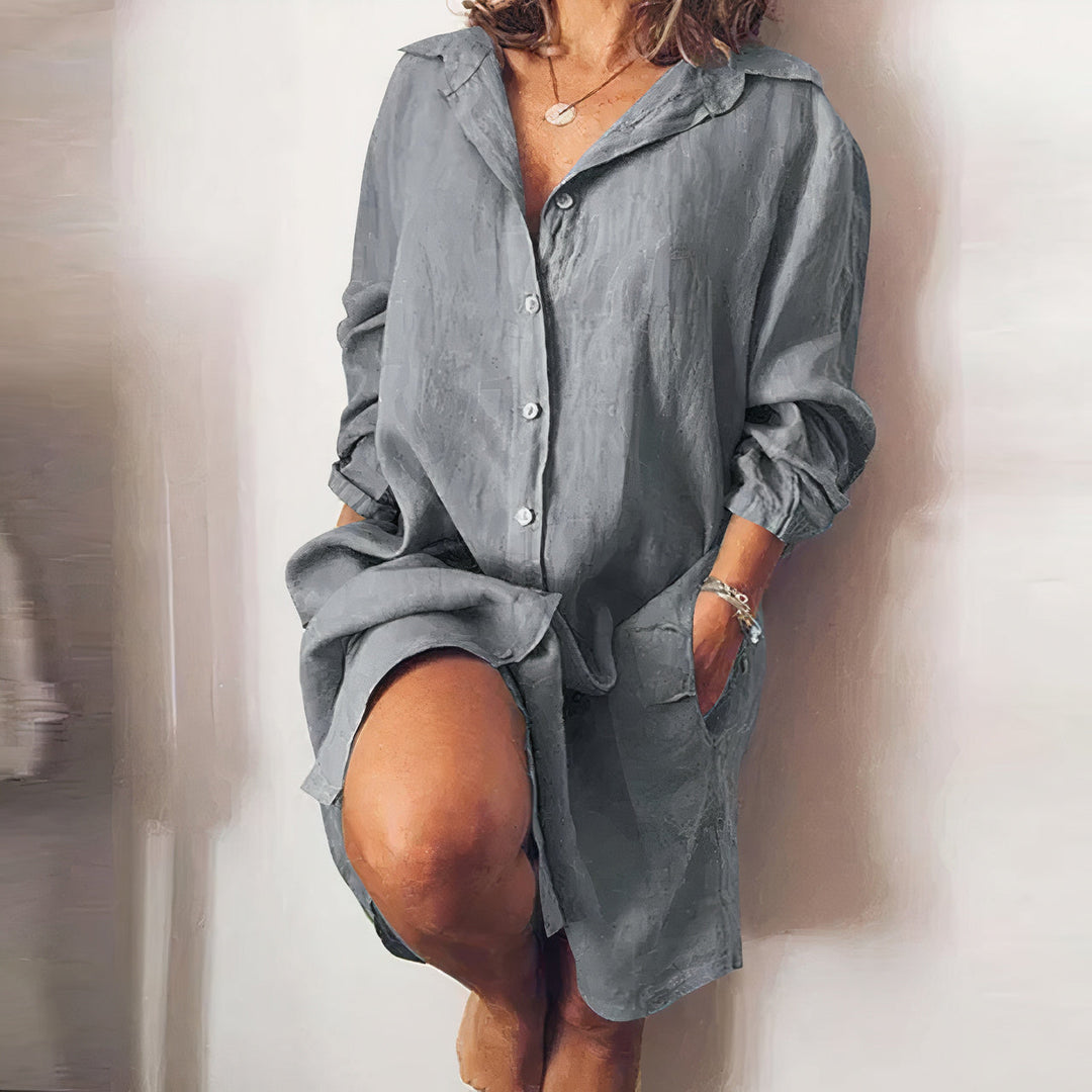Model wearing a chic oversized button-down midi shirt dress for an effortless casual summer look.
