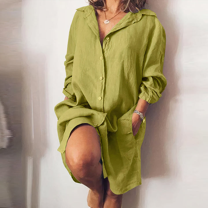 Comfortable women's oversized shirt dress, a versatile button-down midi for relaxed everyday style.