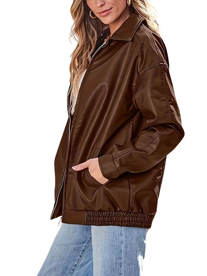 Casual black oversized faux leather bomber jacket for women, chic fall look