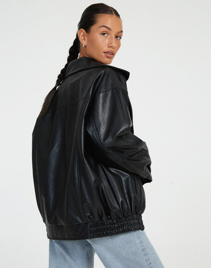 Women's oversized black faux leather bomber jacket, a fashionable and versatile piece of outerwear.