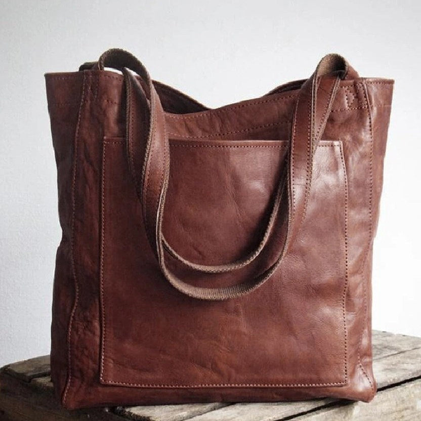 Grained leather oversized tote bag for women, featuring a spacious design & external pocket.