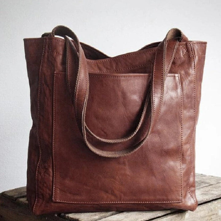 Grained leather oversized tote bag for women, featuring a spacious design & external pocket.