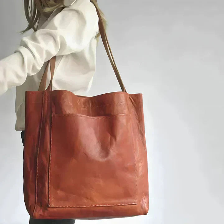 Elegant women's leather shoulder bag, an oversized tote with a useful large external pocket.