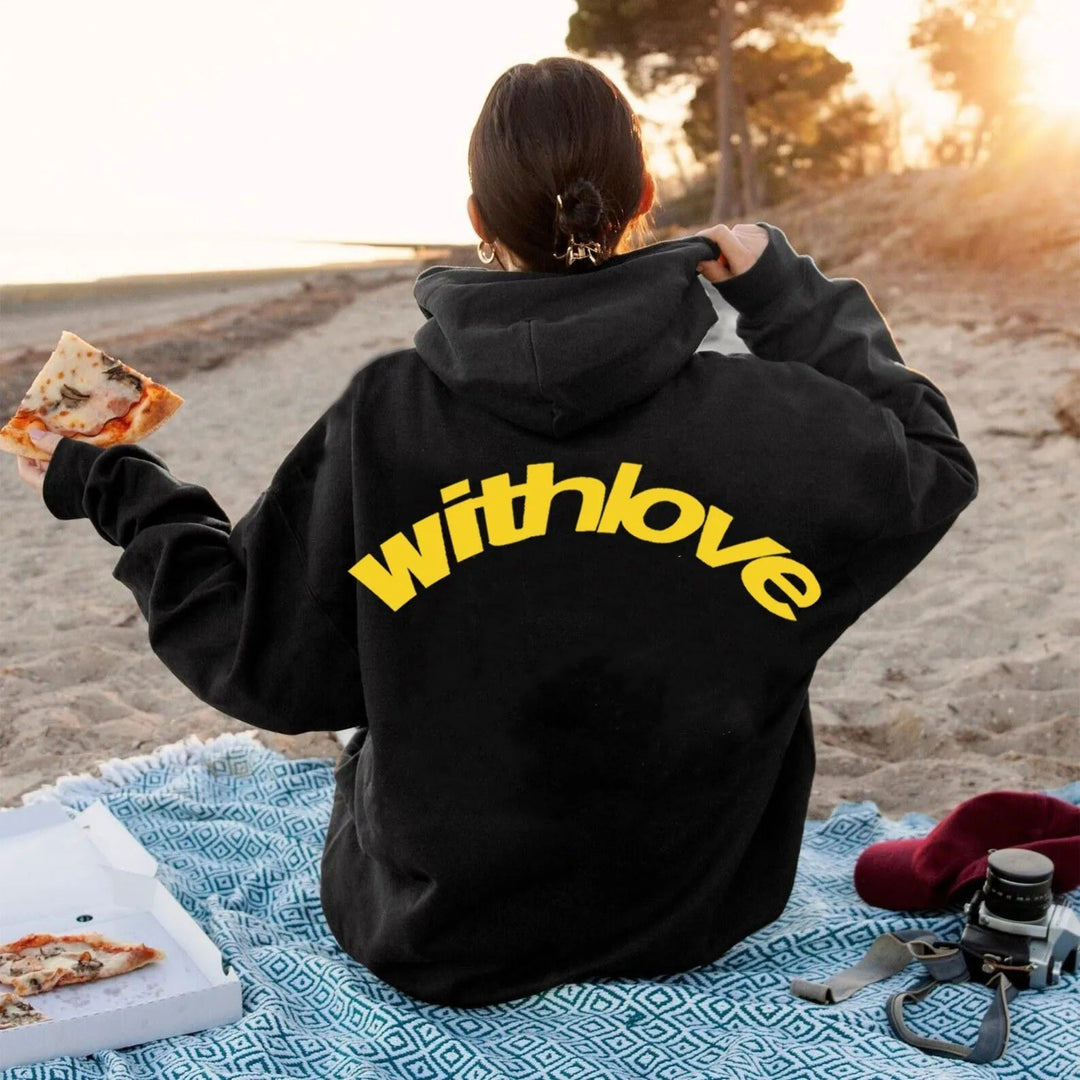 Fashion-forward women's oversized graphic cropped hoodie, a casual streetwear statement piece.