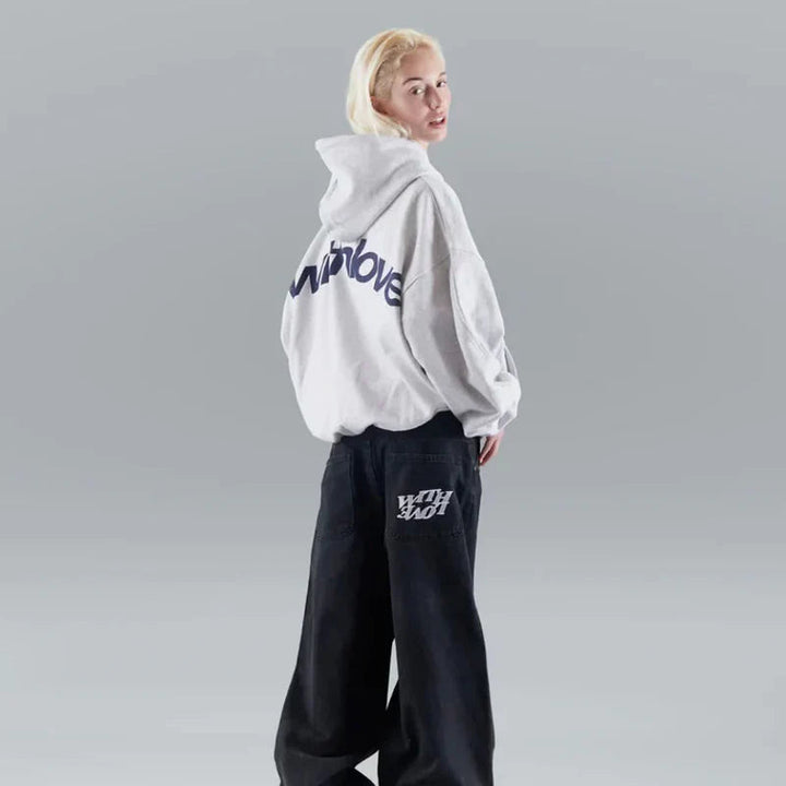 Modern women's cropped graphic hoodie featuring an oversized fit, perfect for contemporary streetwear fashion.