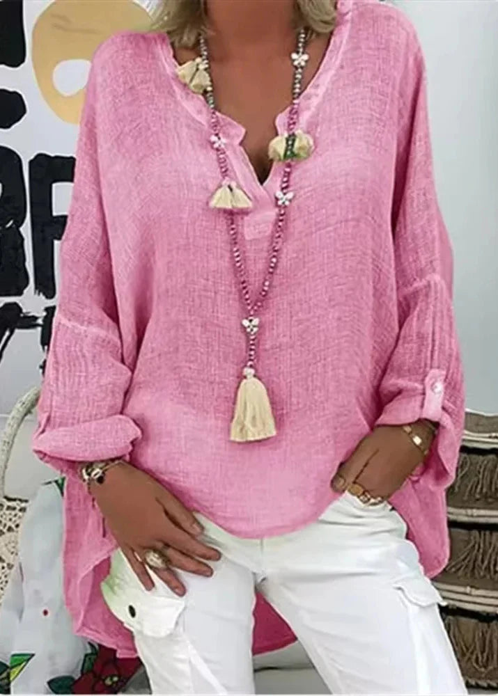 Stylish women's oversized long sleeve blouse. Versatile for office wear or casual chic outfits. Modern fit.