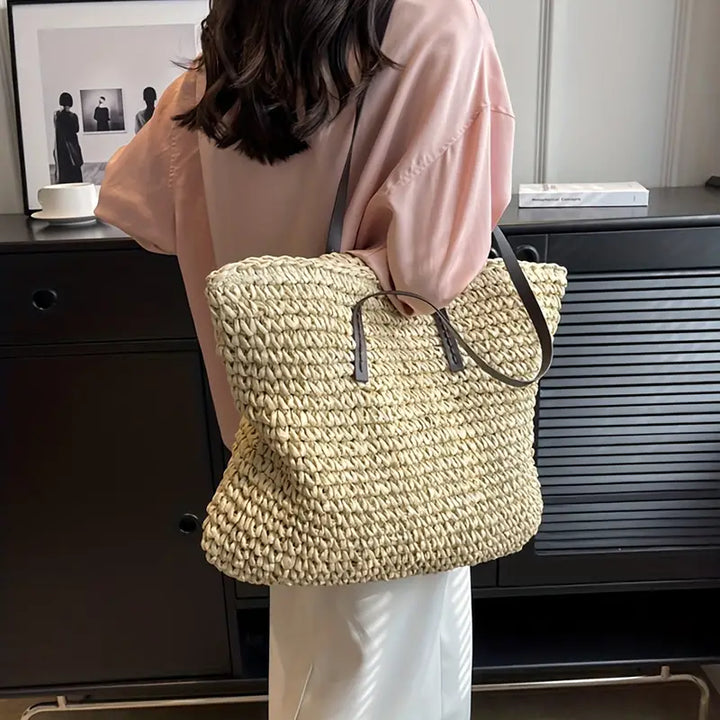 Chic women's oversized straw tote bag, a beautiful woven accessory for beach and summer fashion.