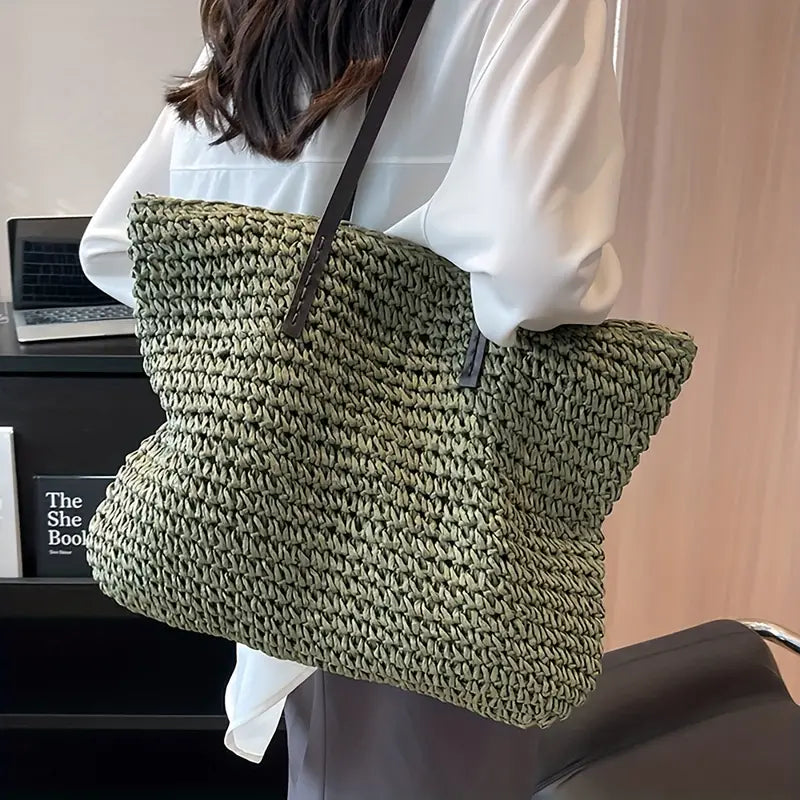 Woven straw beach tote bag for women, ideal oversized summer fashion accessory.