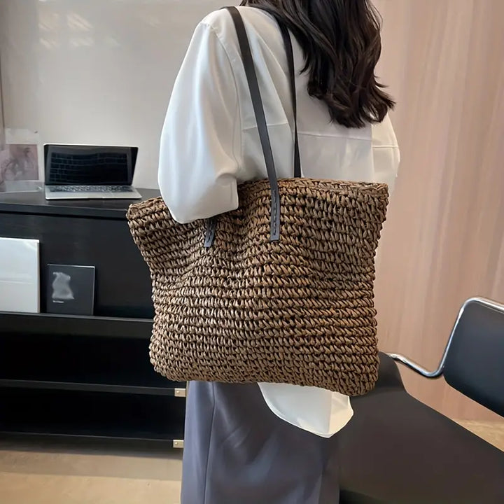Large women's oversized straw tote bag, a durable woven beach bag for all summer adventures.