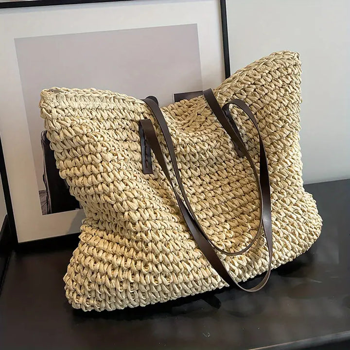 Elegant women's straw beach bag, an oversized tote for carrying all summer essentials.