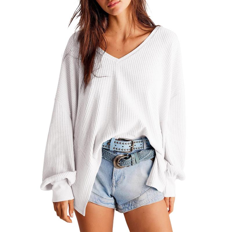 Close-up of a women's comfortable knit V-neck sweater, showing the waffle texture and soft fabric