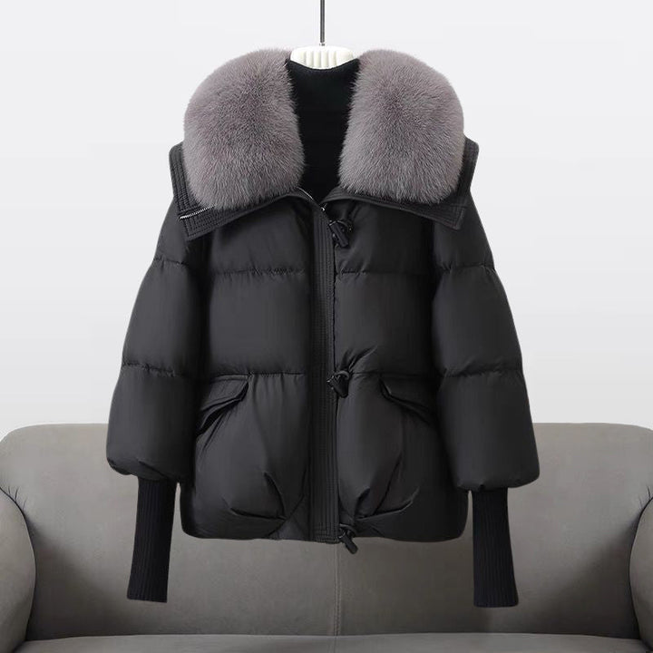 Women's padded warm winter jacket with a luxurious fur collar, ideal for cold weather