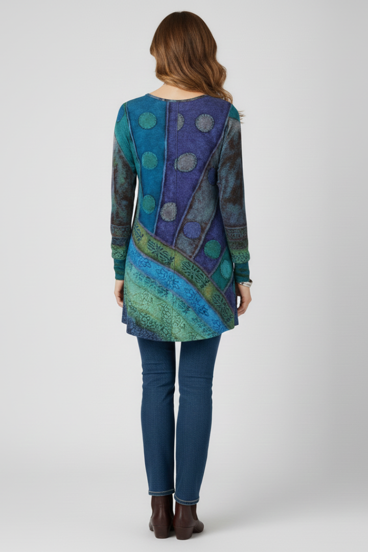 Front view: Women's patchwork tunic top featuring ribbed cuffs, round neck, relaxed & modern casual style.