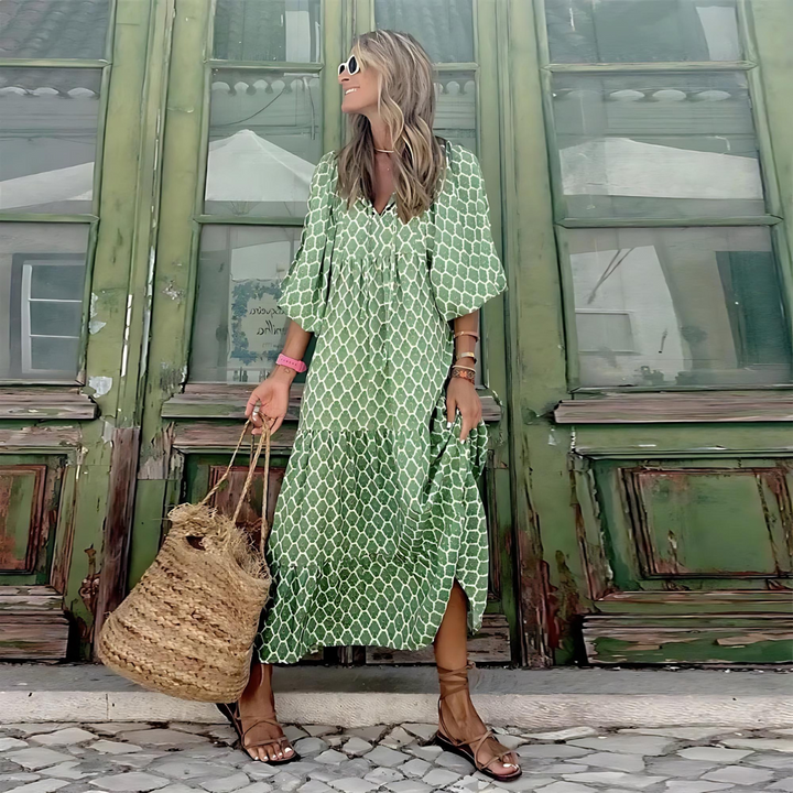 Vibrant patterned long sleeve maxi dress for women. Elegant V-neck, flowy silhouette, perfect for spring outfits.