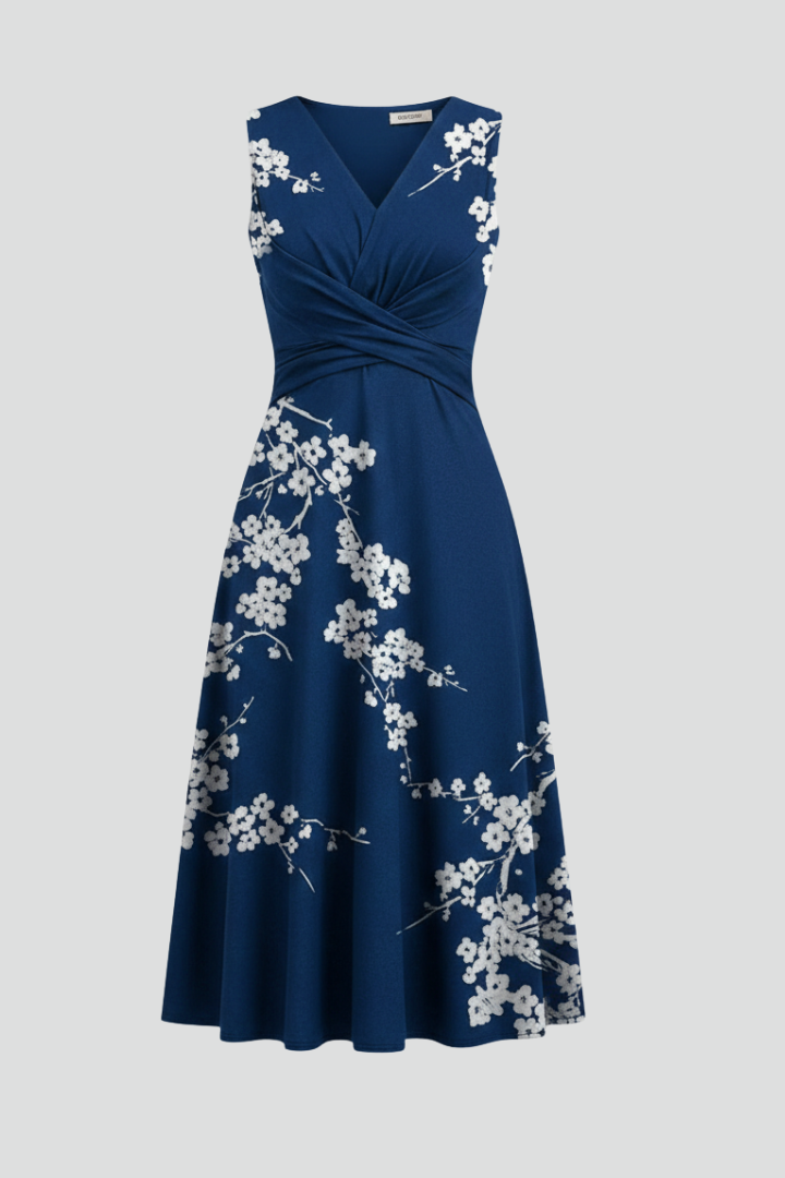 Women's patterned midi dress with a chic V-neck and sleeveless design, perfect for elegant summer fashion.