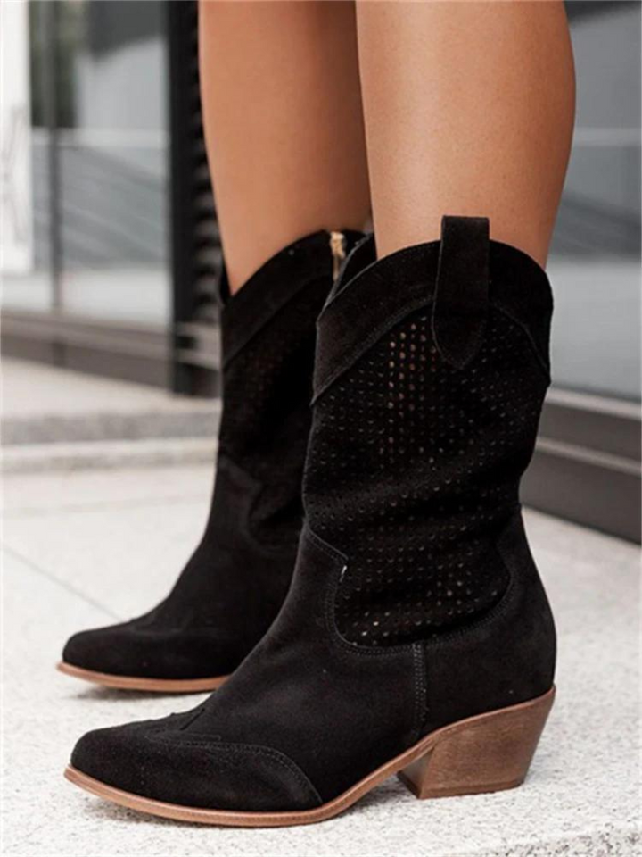 Elegant women's western mid-calf boots with intricate perforated details. Perfect stylish footwear for any occasion.