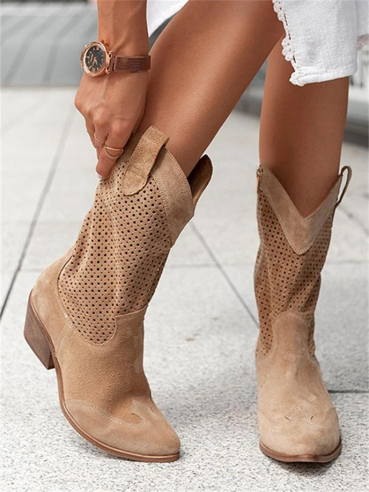 Fashionable women's mid-calf western boots. Perforated design adds style to this versatile cowgirl footwear.