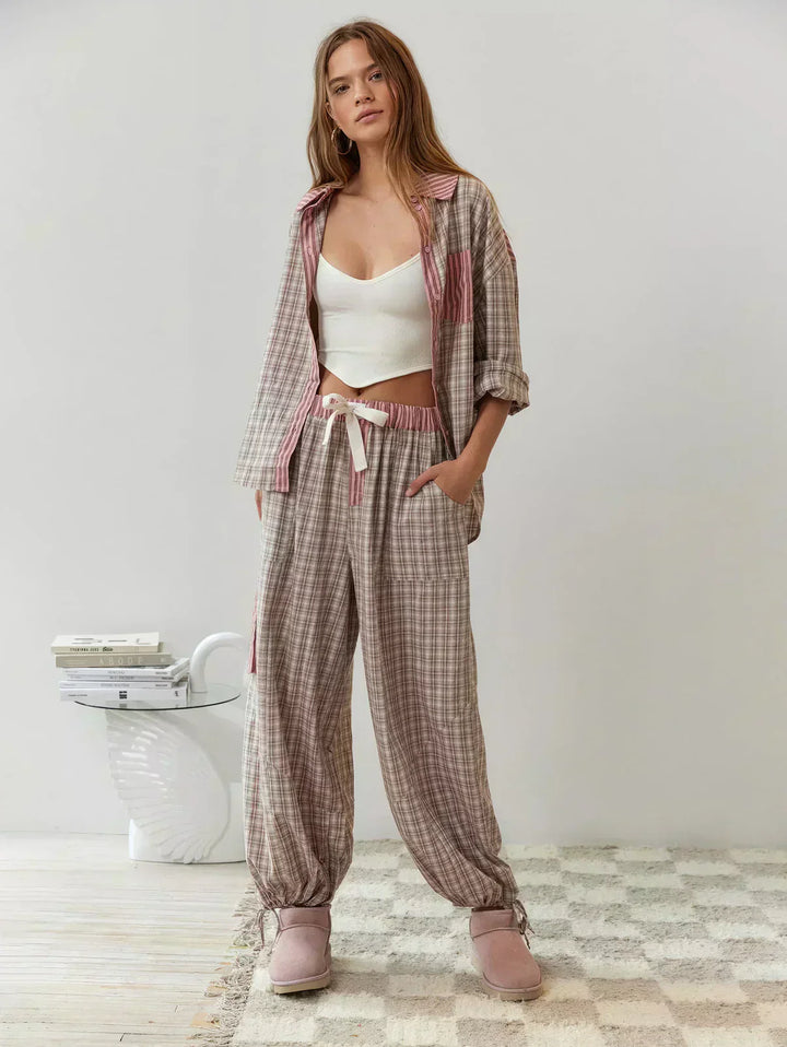 Full body shot of a woman wearing a pink and blue plaid two-piece set, perfect for a casual spring look