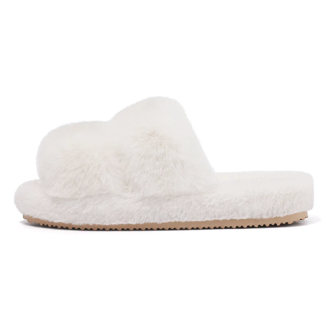 Collection of women's faux fur slippers in various colors: pink, cream, black, blue, grey