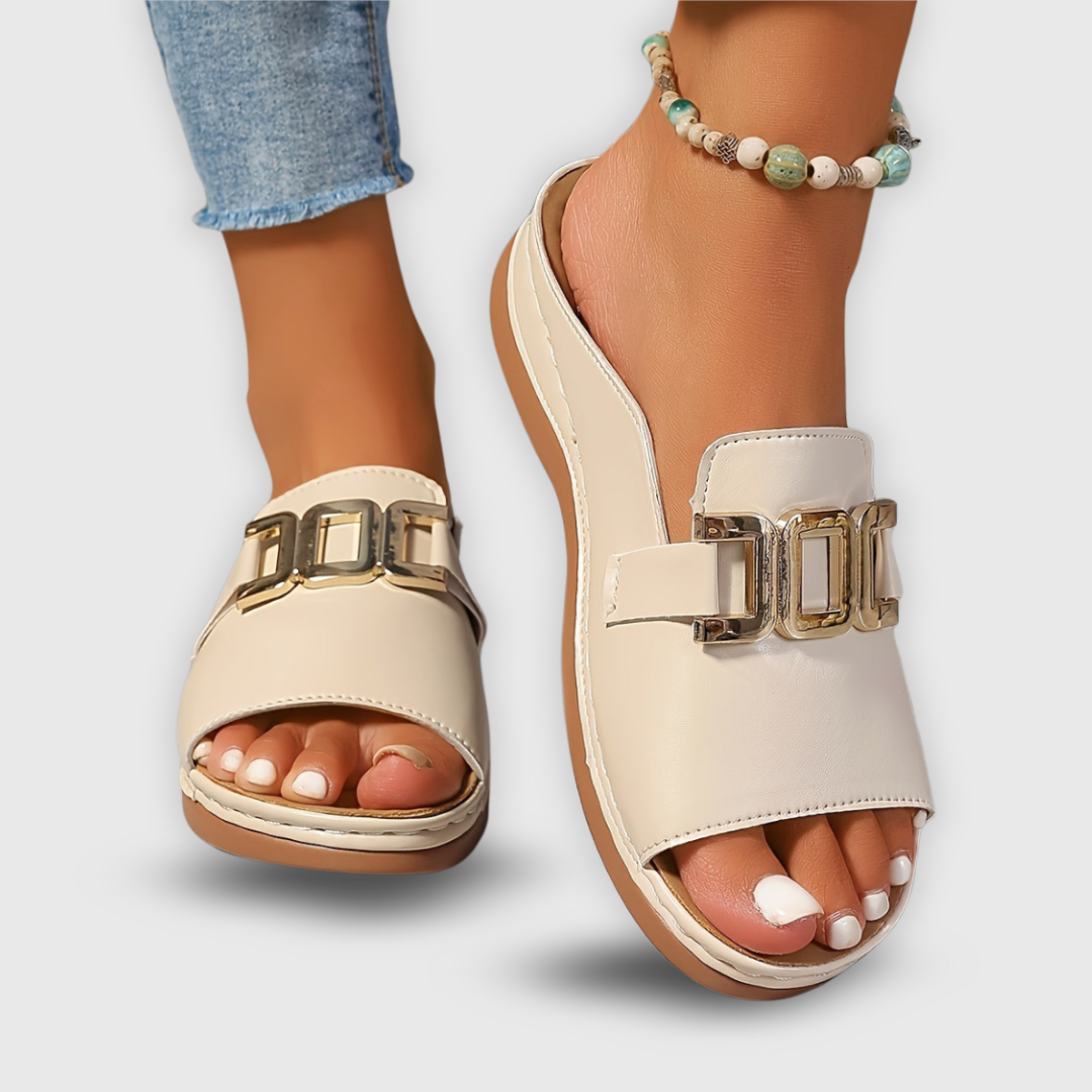Side view of white women's platform slip-on sandals. Elevated design for casual spring comfort.