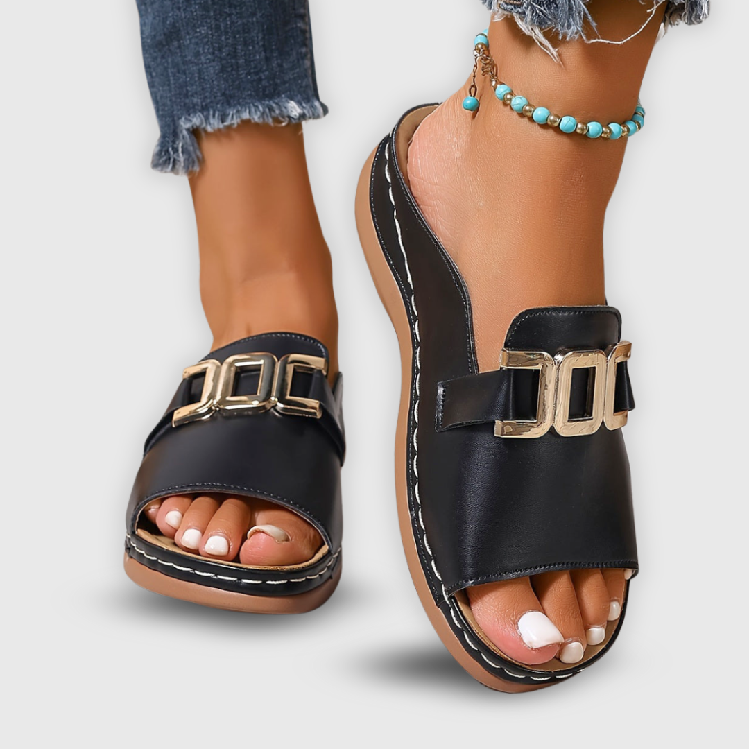Woman walking in comfortable green platform slip-on sandals. Versatile casual spring footwear.