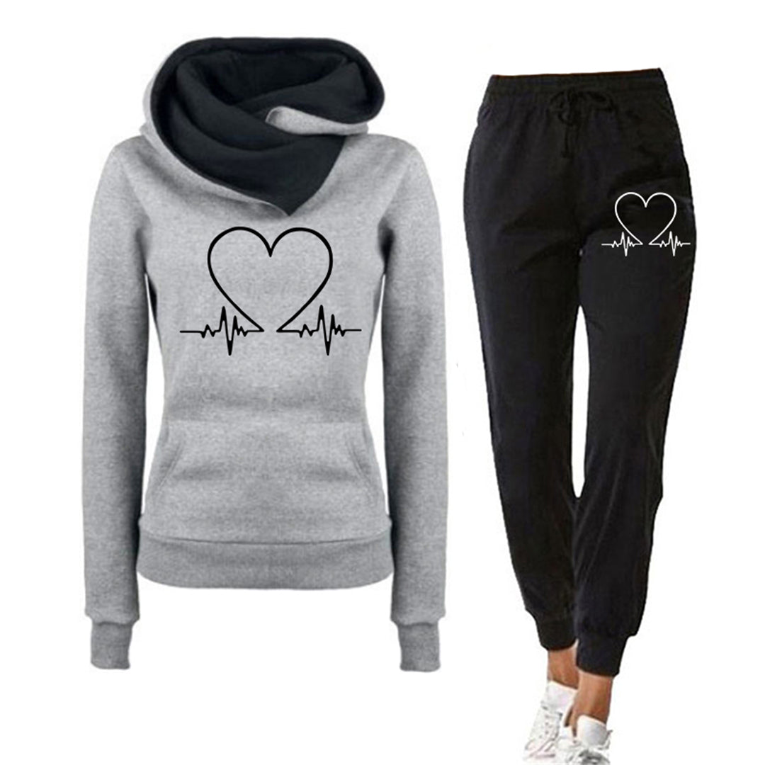Relaxed fit women's loungewear set in pink with a cute heart graphic on hoodie and pants