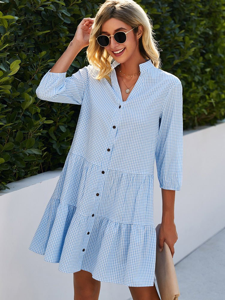 Women's playful gingham tiered button-down mini dress, perfect for a casual summer day. Short and stylish.