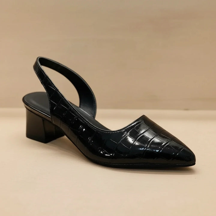 Black elegant women's comfort slingback heels. Features a supportive orthopedic block heel & sleek pointed toe design.